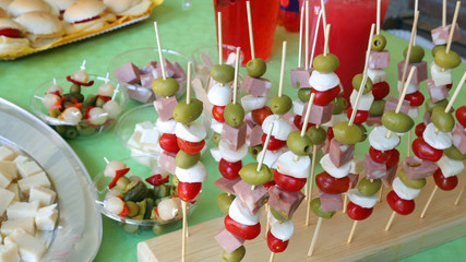 skewers with olives mozzarella cheese and tomatoes