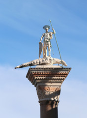 Statue in the Saint Mark Square in Venice with the San Teodoro a