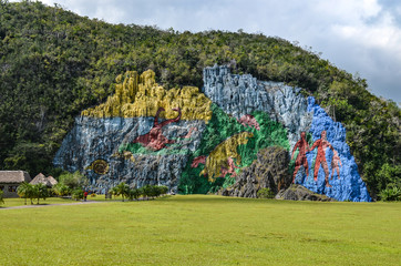 Mural de la Prehistoria, a giant mural painted on a cliff face in the Vinales area of Cuba. © Mark