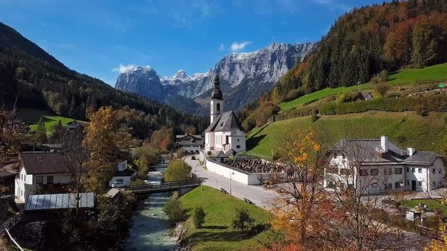 Flight near famous Parish church St. Sebastian, in Ramsau, Berchtesgaden, Bavarian Alps Germany.