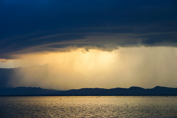 Beautiful rain storm in the Lake,with dark blue sky