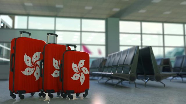 Travel suitcases featuring flag of Hong Kong. Tourism conceptual animation