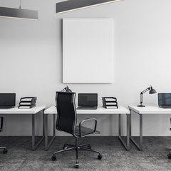 Bright office with empty poster