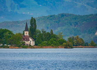 The charming village of Busskirch (Kirchdorf), Rapperswil-Jona, Sankt Gallen, Switzerland. Located in an idyllic lakeside shore of the Obersee (Upper Lake Zurich)
