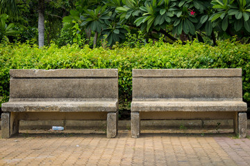 chair cement public park with litter. garbage. leaf. chair dirty. empty