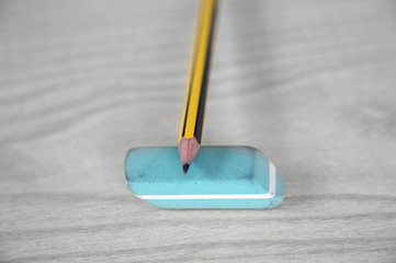 Close-up of a pencil and eraser on desk