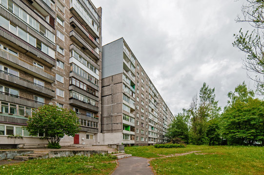 Old soviet residential buildings with a trees around it