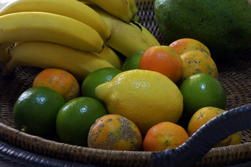 Wicker fruit bowl with bananas and lemons