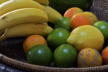 Wicker fruit bowl with bananas and lemons