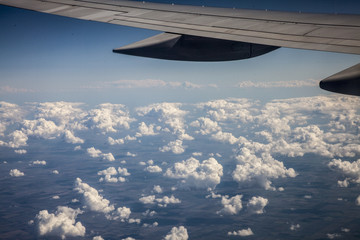clouds under the wing of the aircraft