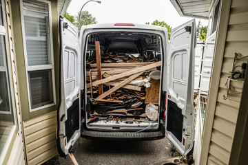 Large van packed with hardwood flooring to be dumped