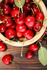 Cherry. Red fresh Cherries in bowl and a bunch of cherries on the table
