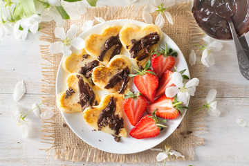 Pancakes hearts with strawberries