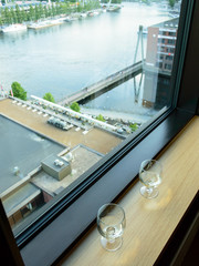 empty glasses in front of window