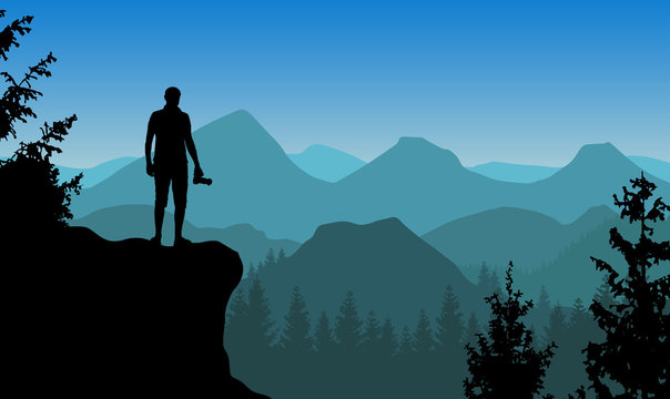 Vector landscape with a man standing on a cliff holding camera and watching blue misty mountains.