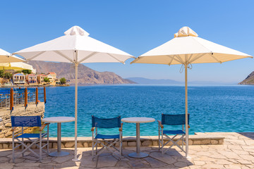 View of restaurant on sea coast on Symi island. Greece