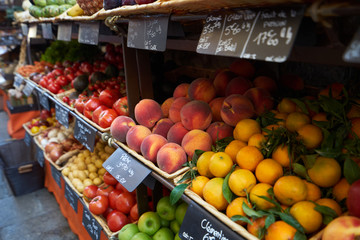 Street market with seasonal tasty fruits and sweets