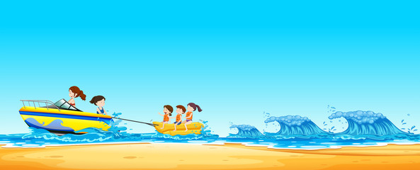 Kids  Riding Banana Boat in Ocean