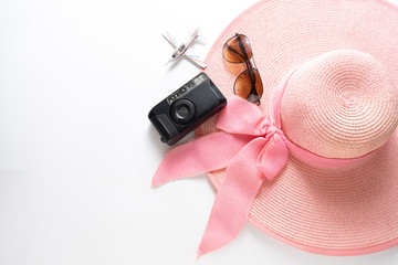 pink hat with white sunglasses and small plane isolated