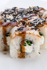Sushi set and composition at white background. Japanese food restaurant, sushi maki gunkan roll plate or platter set.