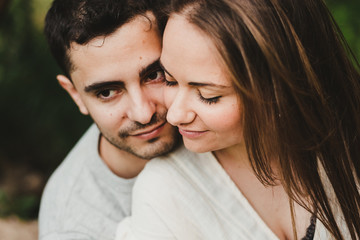 Couple in love hugging each other with their hands
