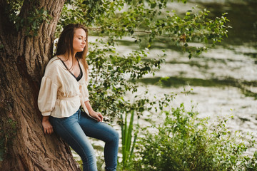 Pretty young girl without posing naturally in nature