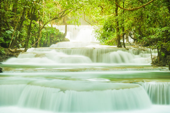 Wonderful green waterfall and nice for relaxation, Breathtaking and amazing turquoise water at the evergreen forest, Located Erawan waterfall Khanchanaburi Province, Thailand © peangdao