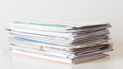 Pile of mails on white background