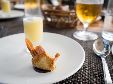 Single Deep Fried Dumpling in Luxury Restaurant on White Plate