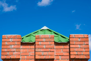 Red brick wall with towers patterns for text, copyspace, close-up   © golubka57
