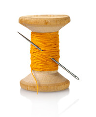 spool of thread with a needle