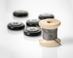 spool of thread and buttons