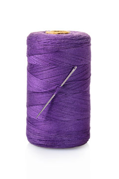 spool of purple threads