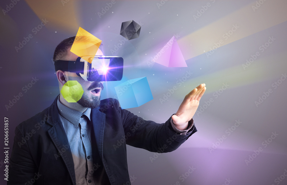 Poster amazed businessman with virtual reality colorful geometric shapes in front of him