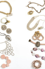 Set of women's jewelry in vintage style necklace cameo pearl bracelet chain earrings on white...