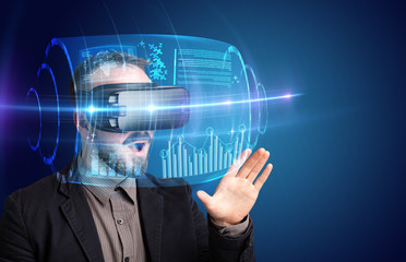 Amazed businessman with high tech 3D projection in front of him 