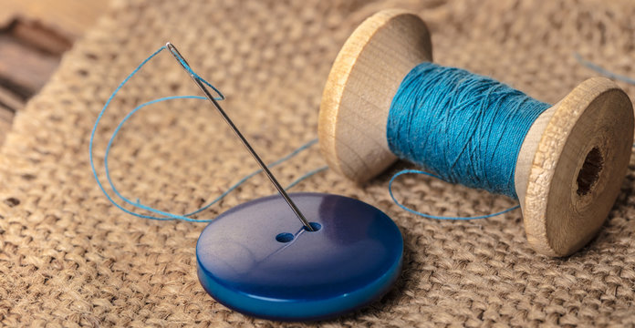 blue button with needle