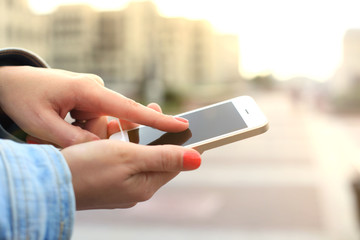 Close up of a woman using mobile smart phone.