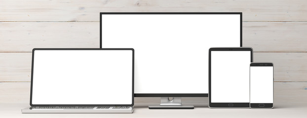 Set of realistic blank monitors. Computer monitor, laptop, tablet and smartphone on wooden background, copy space. 3d illustration