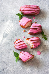 French eclairs with fruit pink glaze