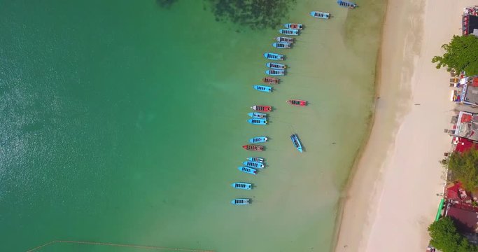 Aerial view from the drone on the taxi boats at the  sand beach of Thailand,koh Phangan island

