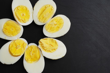 Hard Half Boiled Eggs, Sliced in Halves Food Ingredient Preparation Black Background