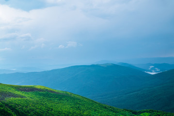 tops of the mountains and rainy clouds of the landscape 