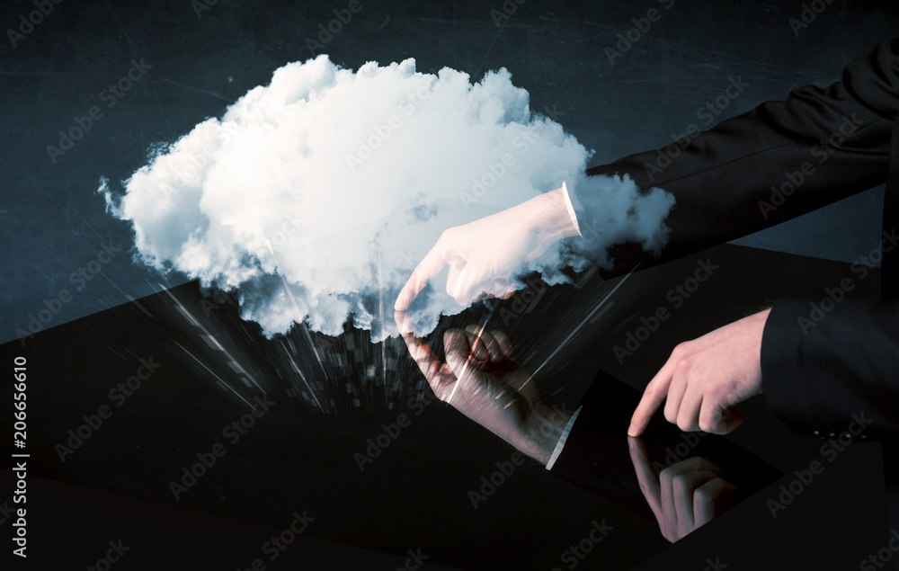 Poster male hands touching interactive table with a white cloud on it