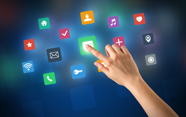 Female hand touching colorful applications 