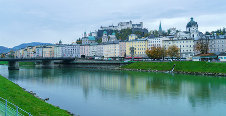 Fototapeta na wymiar View of Salzach river embankment and Hohensalzburg Castle, Salzburg, Austria