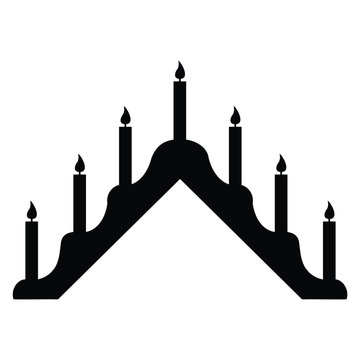 A black and white silhouette of a candelabra