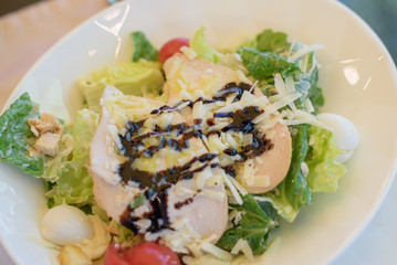 Caesar salad on a white plate