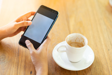 Play the mobile phone and drinking coffee in the morning.