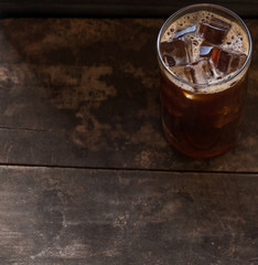 Iced coffee on wooden background